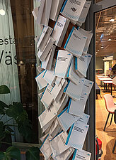 Research papers from the partner university University West in Trollhättan/Sweden are "nailed to the wall" in a ceremony in the foyer after publication.