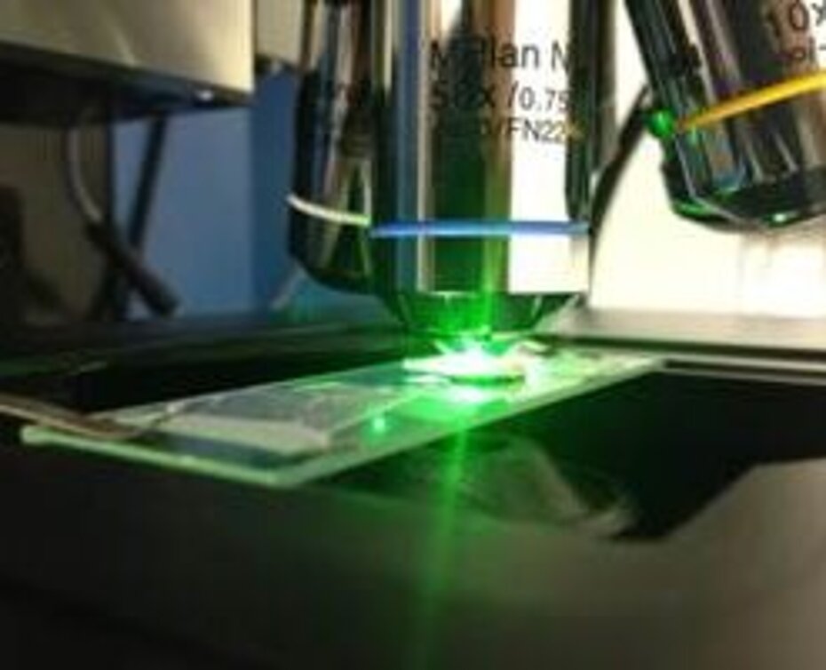 Close-up picture of the Raman micro- scope. Close-up picture of the Raman micro- scope.