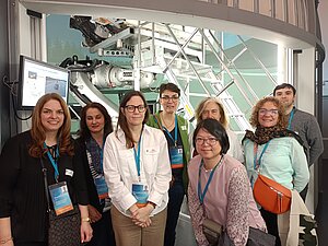 Some participants of the 2024 Staff Training Week during a visit to the Driving Simulator at Fraunhofer ITWM